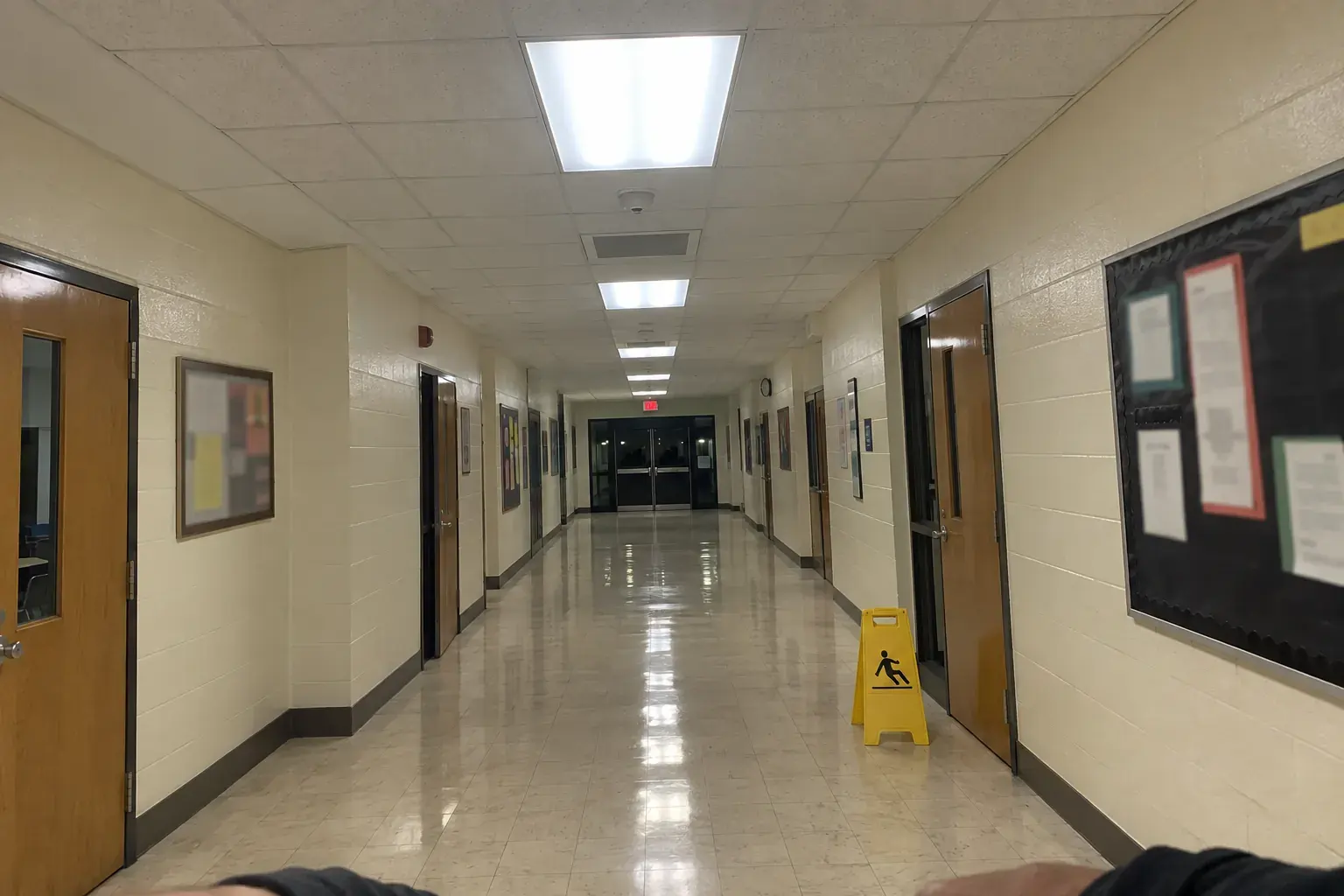 Phone tipped too high: the hallway and ceiling fill the frame and the hands are cut off.